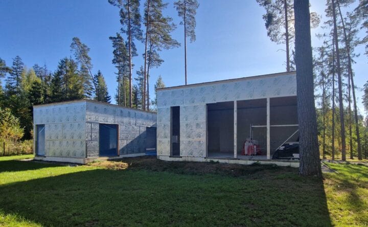 Construction progress of a home built using Solaris plans, with the next steps being window installation and wood facade finishing