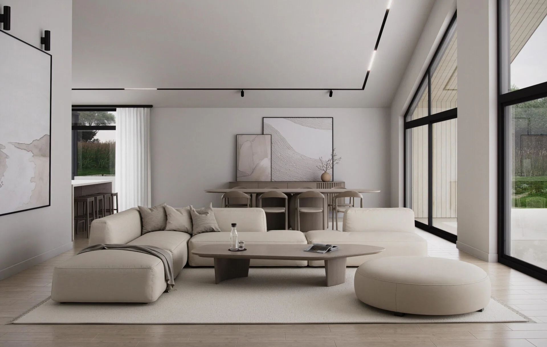 Aurora living room with vaulted ceiling, floor-to-ceiling windows, neutral sectional sofa and ottoman, oval coffee table, and adjacent dining area filled with natural light