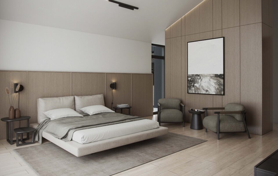 Aurora master bedroom with king-size bed, wood panel walls, vaulted ceiling, neutral tones, and a cozy seating nook